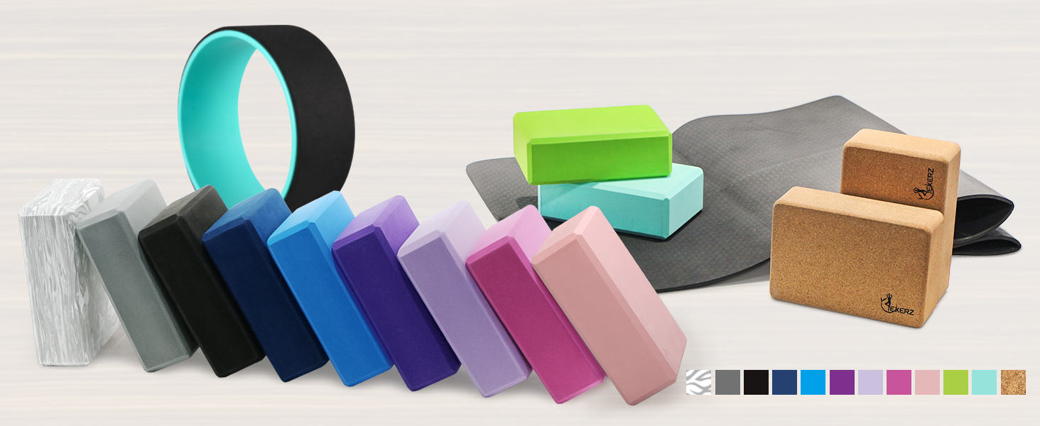 Collection of foam blocks and tape rolls in various colors including teal, purple, pink, blue, black, and gray, arranged in a row on a light surface.