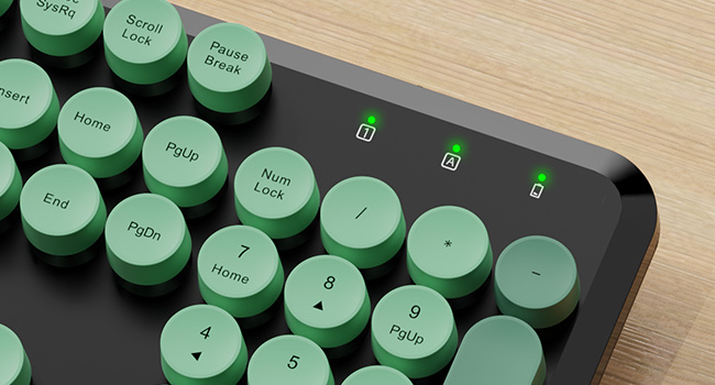 Close-up of the Green Black round-key keyboard showing the number pad and indicator lights.