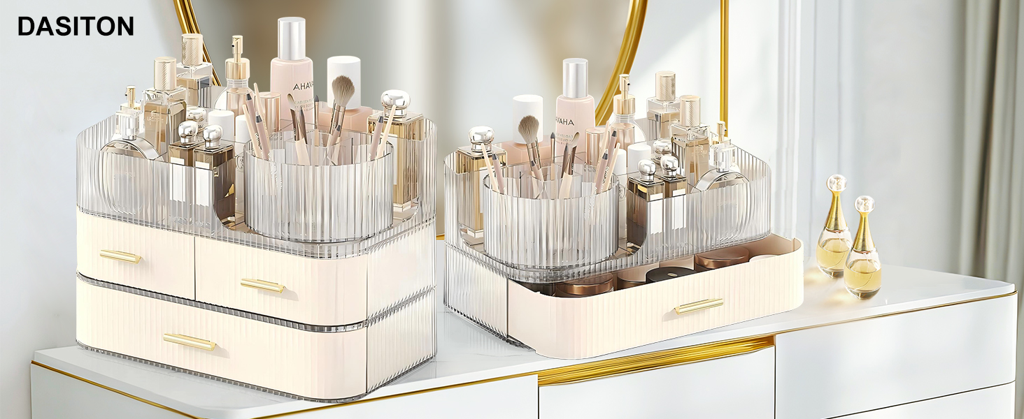Cosmetic organizers with clear acrylic compartments and beige bases. Multiple makeup brushes and bottles visible. Gold-trimmed design on white surface.