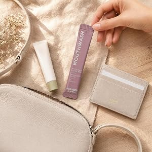 Mouth wash sachet amongst purse contents. Travel friendly product.