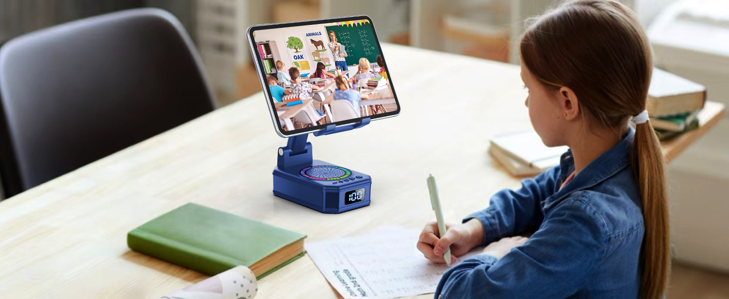 Young student using tablet mounted on blue rotating stand during remote learning session, with books on desk.