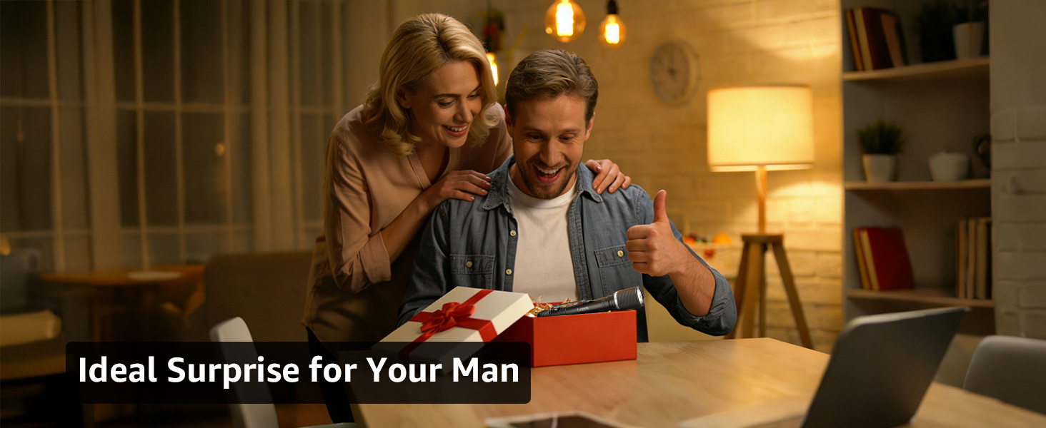 Text reads 'Ideal Surprise for Your Man'. Warm-lit domestic scene showing comfortable indoor setting with table lamp and cozy atmosphere.