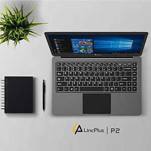 LincPlus P2 laptop with gray chassis and Windows 10 display, shown with black notebook and stylus pen against white surface with decorative plant.
