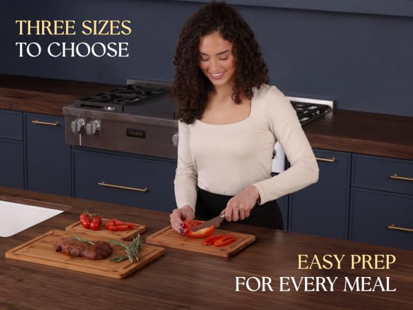 model using the 3pc carbonized cutting board set in her kitchen, preparing a meal