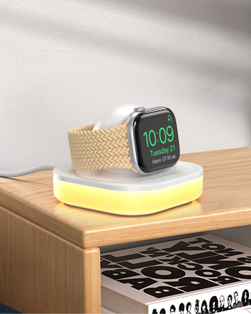 a small apple watch stand on a desk.