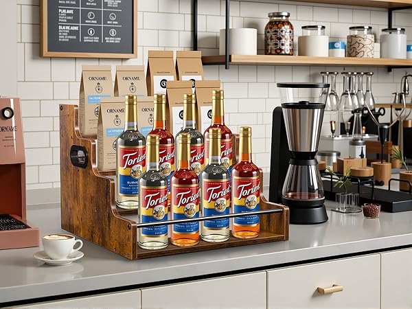 Coffee syrup bottle organizer for home cafe, tiered stand for Torani syrups and accessories.