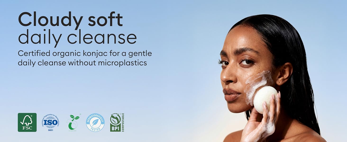 Text reads 'Cloudy soft daily cleanse' with 'Certified organic karolin for a gentle daily cleanse without microplastics'. Beauty product advertisement showing skincare demonstration with cotton pad.