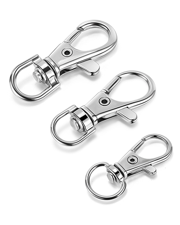 Three silver metal swivel clips of varying sizes with spring-loaded gates and key rings attached. Used for quick attachment and detachment of items.