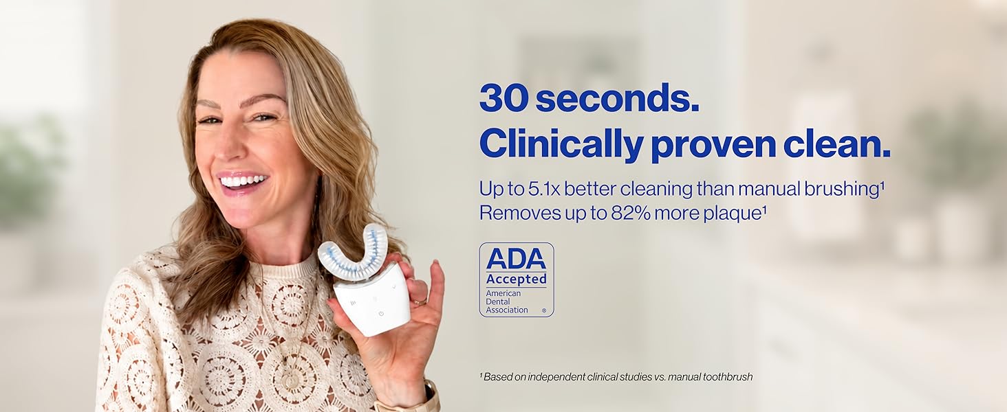 Woman holding Autobrush and smiling, ADA seal on the right