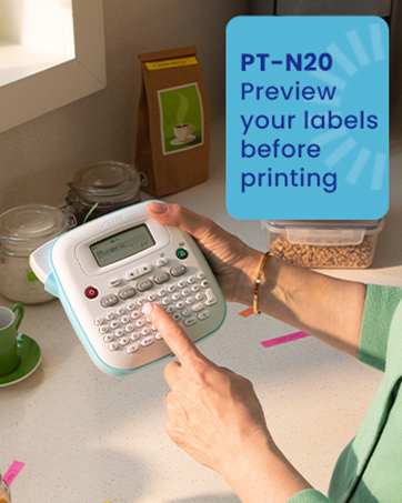 PT-N20 labeler: Preview your labels before printing. Woman in kitchen typing on label maker