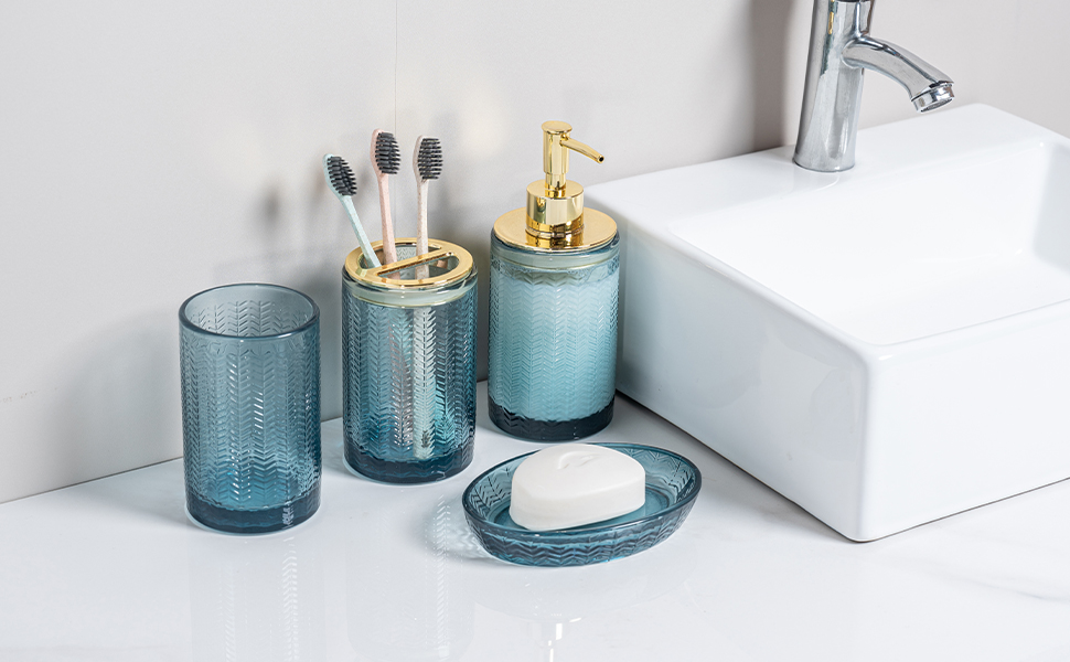 4 piece bathroom accessories set with transparent blue glass finish and brass accents