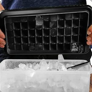 easy release ice cube tray, just twist and empty the tray into the container.
