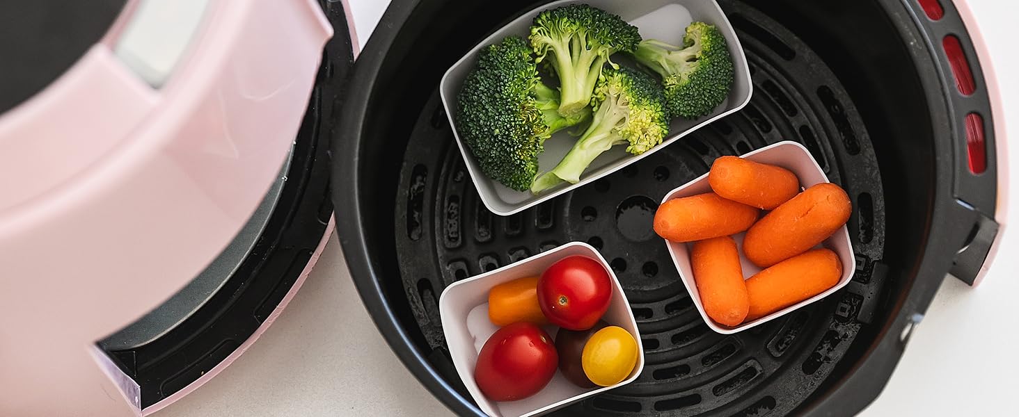 Square and rectangle silicone baking cups in an air fryer with vegetables