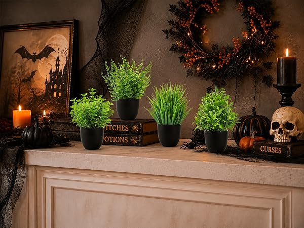 four artificial green plants black pots halloween decor