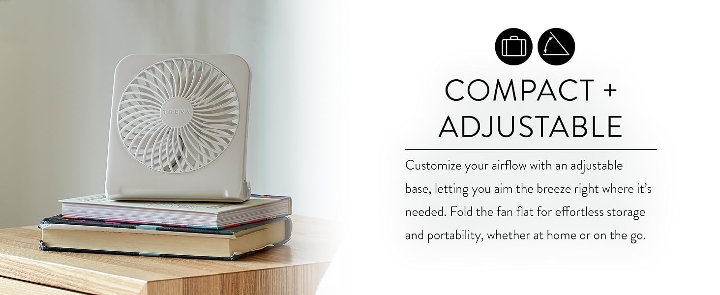 White Treva USB rechargeable fan on side table on stack of books