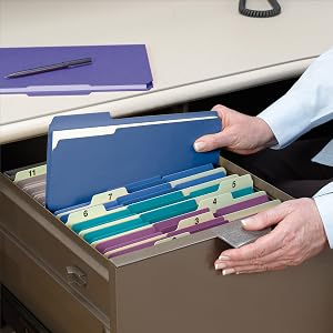Smead colored file folders, office setting, desk drawer, black pen and telephone