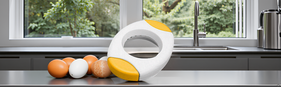 A kitchen counter with a bowl of fresh eggs and the product lying next to it.