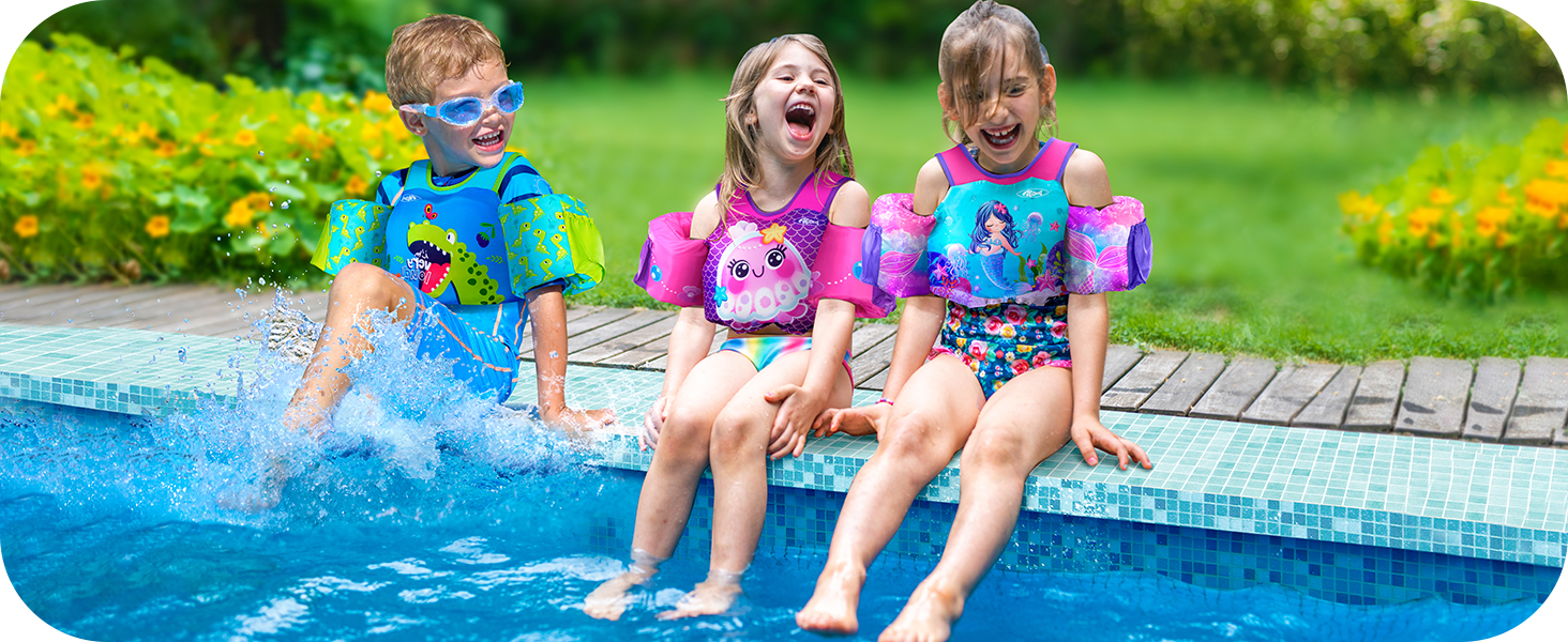 3 kids play water at pool