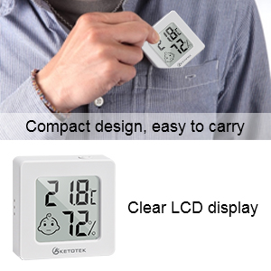 Compact digital thermometer and hygrometer with clear LCD display showing temperature and humidity. Held in hand for size reference.