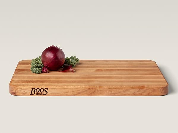 Boos Block Maple Wood Edge Grain Cutting Board with berries on top.