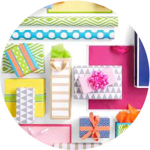 Colorful wrapping paper, bows, ribbon, tissue paper and gift bags by Hallmark