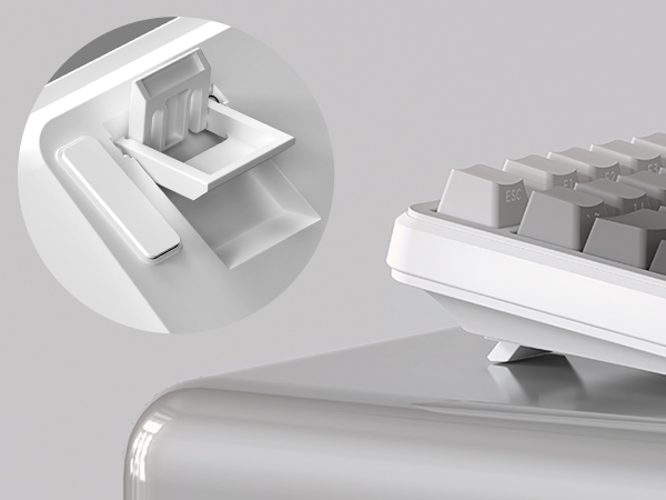 White mechanical grabber tool shown in detail with extended claw mechanism, trigger handle, and articulated gripping jaws demonstrating functional grabbing capability and design construction.