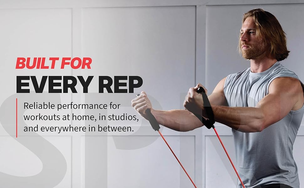 Man using resistance band with handles performing upper body exercise with SPRI Xertube