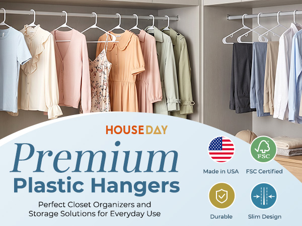 White plastic hangers holding shirts, long dress, and pants. Sleek uniform look. Perfect for scloset