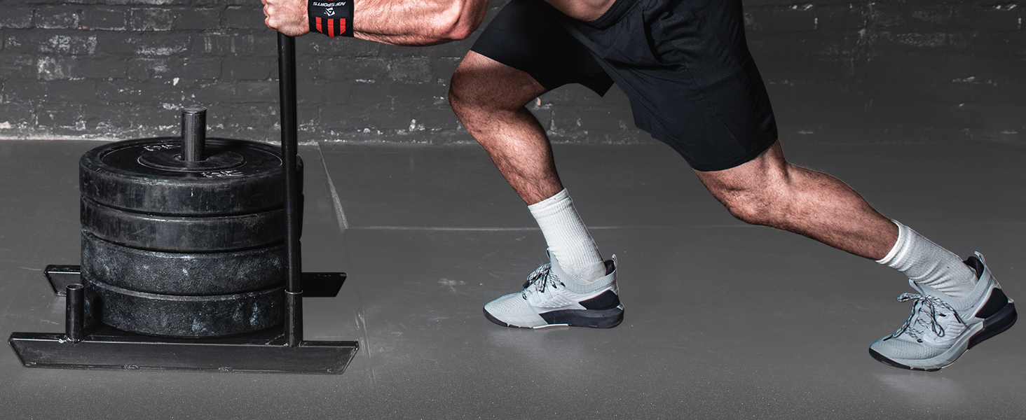 a man wearing a pair of white socks and a black gym shoe