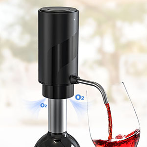 Electric wine aerator pouring red wine into a glass. Device has a black top and silver body with oxygen inlets visible.