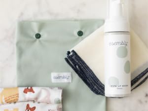 Esembly Wipe Up Wash Foamer next to Wipe Ups and on top of two Snack and Sammy Pouches
