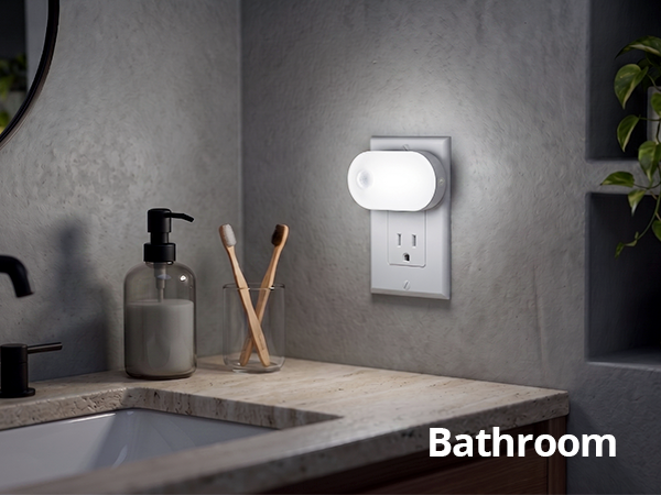 Eye-friendly plug-in night light illuminating a bathroom.
