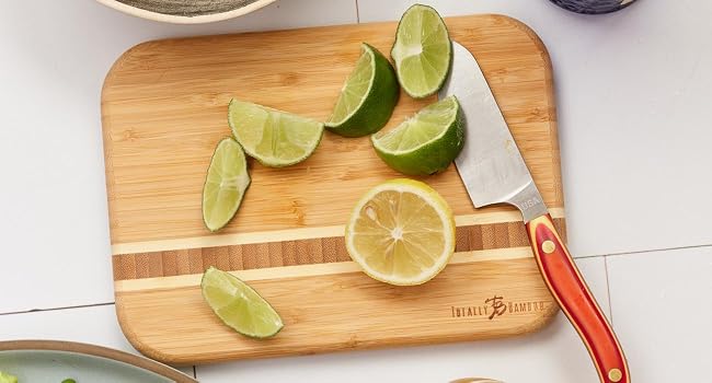 The Barbados Cutting and Serving Board being used to cut limes.