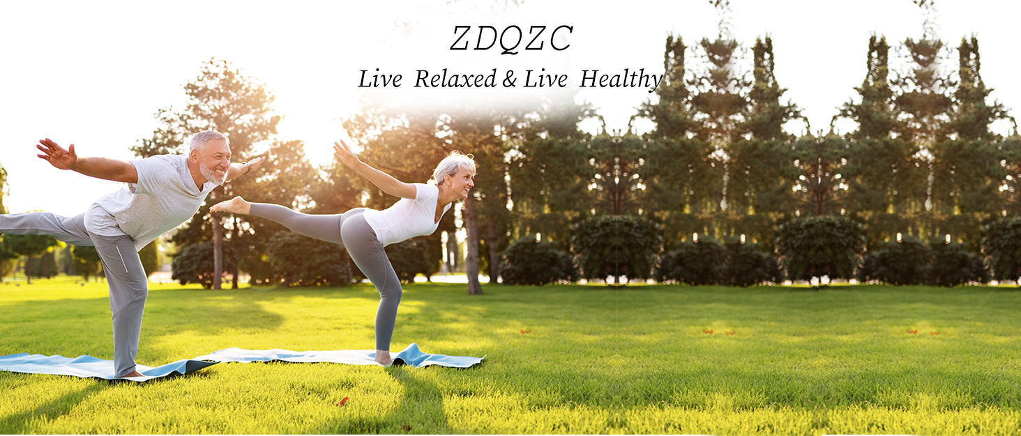 Two elderly people are practicing yoga on the lawn.