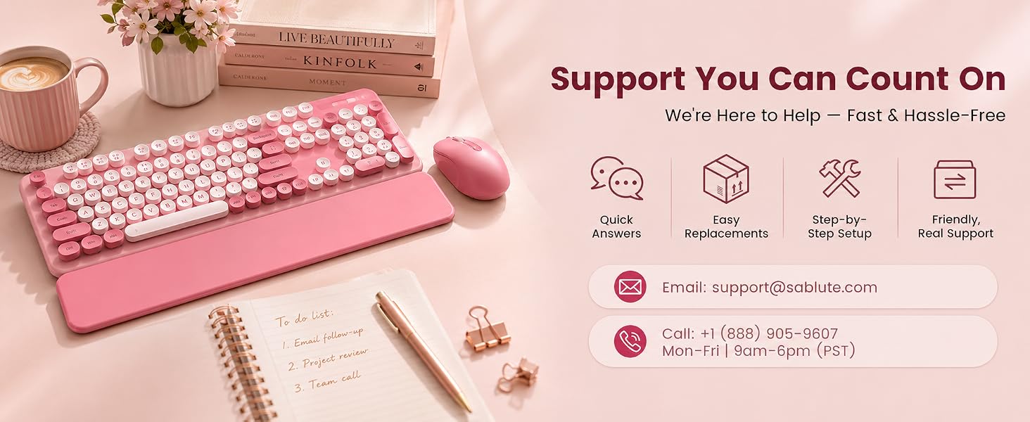 Pink keyboard and matching mouse with wrist rest beside Sablute help details on a blush desk.