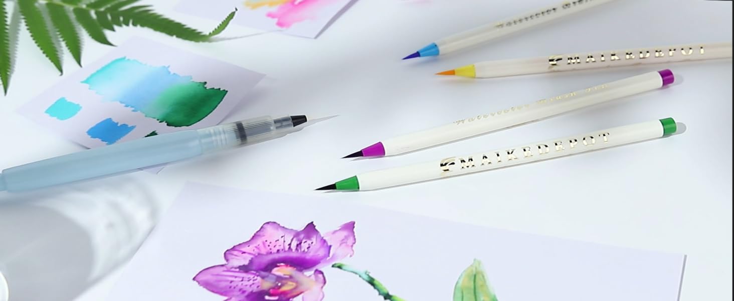 assorted color brush pens