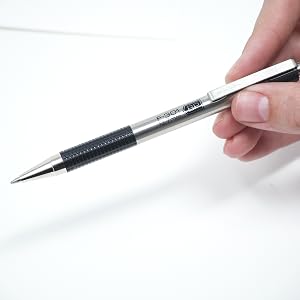 zebra pen f-301 retractable ballpoint pen closeup, desk background