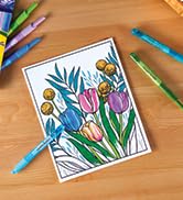 clicks markers drawing flowers on paper