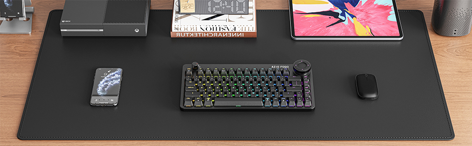 a keyboard and mouse pad on a desk