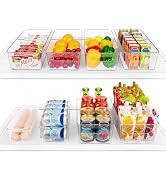 Clear plastic drawer organizers containing various food items and beverages, arranged in two rows showing organized refrigerator storage.