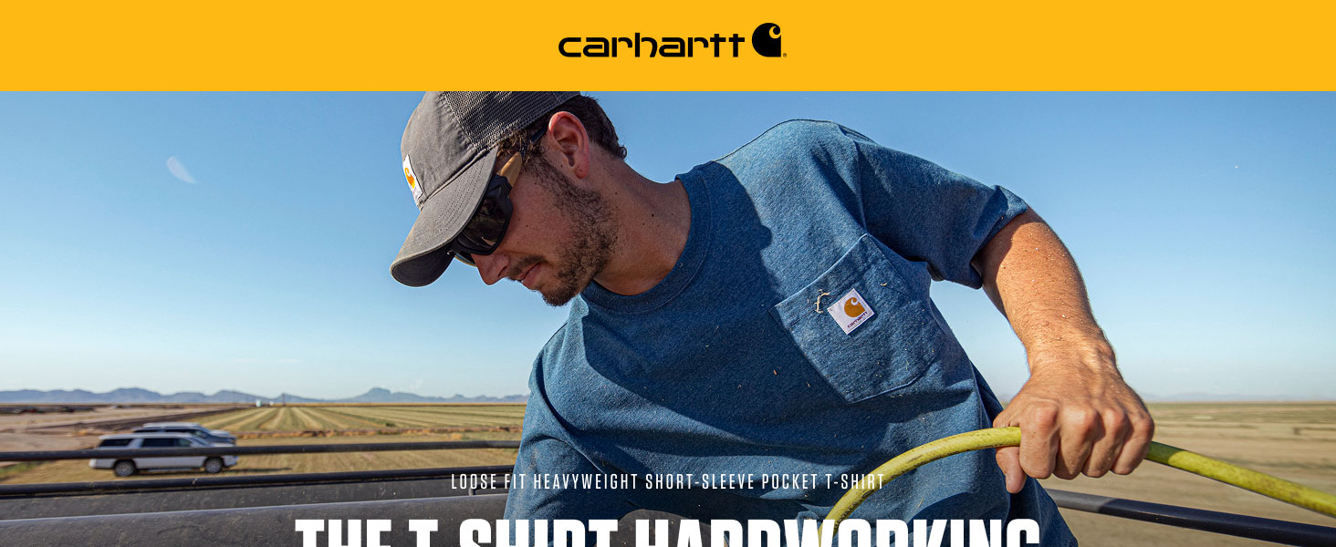 Man wearing a Carhartt Men's Loose Fit Heavyweight Short-Sleeve Pocket T-Shirt in blue