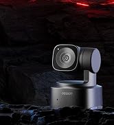 Black professional camera mount or gimbal device photographed against dark background with dramatic lighting.