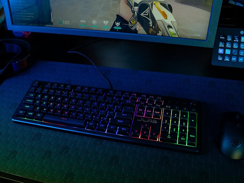 Nightfall gaming keyboard on a gaming pad with a monitor in the background