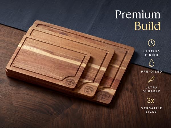 Acacia Cuttiing Board set in three sizes stacked on a kitchen surface, highlighting features