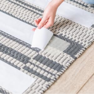 Tape on the bottom of rug.