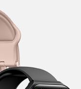 Partial view of a smartwatch with a light pink leather strap and a black square watch face, showcasing the band's attachment mechanism.