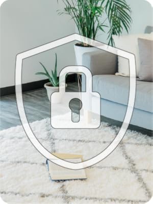Living room with blue couch and large white area rug with graphic of a lock with a keyhole on top.