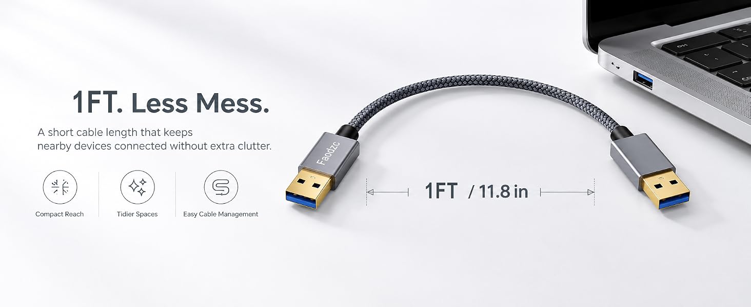1FT short USB-A cable connecting a laptop to reduce desk clutter.