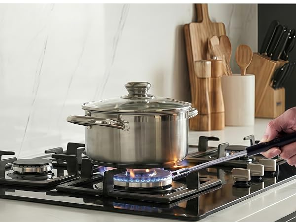 Rechargeable candle lighter with long flexible gooseneck lighting a gas stovetop burner