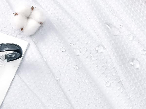 white fabric shower curtain